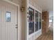 Inviting front porch featuring a well-lit entry with sidelight windows and house number display at 7683 S Steele St, Centennial, CO 80122