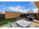 Backyard with deck, grill, and storage shed at 12423 E Louisiana Ave, Aurora, CO 80012