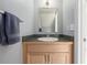 Small bathroom with a single vanity and a dark countertop at 12423 E Louisiana Ave, Aurora, CO 80012