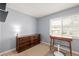 Bedroom with dresser, desk and window at 12423 E Louisiana Ave, Aurora, CO 80012