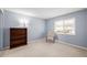 Bedroom with bookcase and comfortable chair at 12423 E Louisiana Ave, Aurora, CO 80012