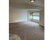 Basement featuring neutral carpet, window with blinds, and ceramic tile accents at 3566 E Fair Pl, Centennial, CO 80121