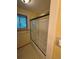 Bathroom featuring a glass-enclosed bathtub and a window for natural light at 3566 E Fair Pl, Centennial, CO 80121
