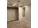 This bedroom is carpeted with neutral walls and a closet with shelving at 3566 E Fair Pl, Centennial, CO 80121