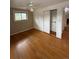 Bedroom showcasing hardwood floors, a ceiling fan and closet storage at 3566 E Fair Pl, Centennial, CO 80121