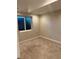 This bedroom has carpet floors, a large window, and neutral walls at 3566 E Fair Pl, Centennial, CO 80121