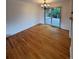 Bright dining area with access to the deck, featuring hardwood floors and modern lighting at 3566 E Fair Pl, Centennial, CO 80121
