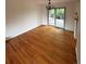 Hardwood-floored dining room with sliding glass doors leading to an outdoor deck at 3566 E Fair Pl, Centennial, CO 80121