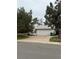 Side view of a well maintained home with a two car garage and an extended driveway at 3566 E Fair Pl, Centennial, CO 80121