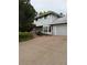 Brick accents and a wood porch are complimented by well-maintained landscaping at 3566 E Fair Pl, Centennial, CO 80121