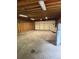 Spacious two-car garage with ample room for storage and workspace with lighting at 3566 E Fair Pl, Centennial, CO 80121