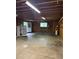Spacious two-car garage with ample room for storage and workspace, and featuring door to exterior at 3566 E Fair Pl, Centennial, CO 80121