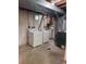 Practical laundry room with washer and dryer, utility sink, and ample space at 3566 E Fair Pl, Centennial, CO 80121