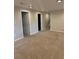 Carpeted living room offering multiple doorways and recessed ceiling lights at 3566 E Fair Pl, Centennial, CO 80121