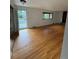 Spacious living room with a brick fireplace and access to the outdoor deck at 3566 E Fair Pl, Centennial, CO 80121