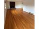 Open living room with hardwood floors and brick fireplace at 3566 E Fair Pl, Centennial, CO 80121
