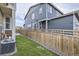 Backyard area featuring a wooden fence and artificial turf at 6233 N Liverpool St, Aurora, CO 80019