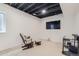 Finished basement featuring dark-painted exposed ceiling, and carpeted floors at 6233 N Liverpool St, Aurora, CO 80019