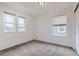Well-lit bedroom featuring multiple windows, neutral carpeting, and ample natural light at 6233 N Liverpool St, Aurora, CO 80019