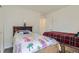 bedroom showcasing twin beds and closet access at 6233 N Liverpool St, Aurora, CO 80019