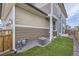 Home exterior with a fenced in yard and artificial turf at 6233 N Liverpool St, Aurora, CO 80019