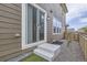 Home exterior featuring a sliding glass door that leads to a fenced in yard at 6233 N Liverpool St, Aurora, CO 80019