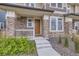 Welcoming front door entrance with stone accents and meticulously maintained landscaping at 6233 N Liverpool St, Aurora, CO 80019