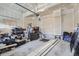 A two car garage with a variety of stored items at 6233 N Liverpool St, Aurora, CO 80019