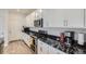 Well-appointed kitchen features modern appliances, stylish cabinetry, and sleek countertops, perfect for culinary enthusiasts at 6233 N Liverpool St, Aurora, CO 80019