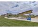 Community park featuring picnic benches and chairs, and shaded coverings at 6233 N Liverpool St, Aurora, CO 80019