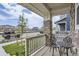 Cozy front porch with decorative chairs and a view of the peaceful neighborhood at 6233 N Liverpool St, Aurora, CO 80019