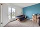 Bright bedroom with a large window offering plenty of natural light and cozy carpet floors at 2311 E 96Th Way, Thornton, CO 80229