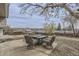 Concrete patio featuring a patio set, outdoor grill, rock landscaping, and fenced in yard at 2311 E 96Th Way, Thornton, CO 80229