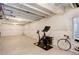 Unfinished basement featuring workout bicycle equipment and insulated walls at 431 Courtfield Way, Castle Pines, CO 80108