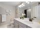 Bright bathroom with double sinks, modern decor, and updated cabinets at 431 Courtfield Way, Castle Pines, CO 80108