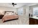 Cozy bedroom featuring soft bedding, wooden furniture, and natural light at 431 Courtfield Way, Castle Pines, CO 80108