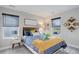 This cozy bedroom has two large windows, lots of natural light and stylish decor at 431 Courtfield Way, Castle Pines, CO 80108
