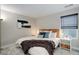 Well-lit bedroom with large window, comfortable carpet and wood accents at 431 Courtfield Way, Castle Pines, CO 80108