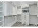 Bright walk-in closet with built in shelving and drawers provides ample storage space at 431 Courtfield Way, Castle Pines, CO 80108