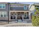 Charming two-story home with a covered porch and professionally landscaped front yard at 431 Courtfield Way, Castle Pines, CO 80108