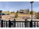 View from the front porch of the home, overlooking the landscaped hill across the street at 431 Courtfield Way, Castle Pines, CO 80108