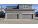 Attached two car garage exterior with brick columns and private driveways at 431 Courtfield Way, Castle Pines, CO 80108