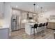 Modern kitchen features stainless steel appliances and stylish pendant lighting at 431 Courtfield Way, Castle Pines, CO 80108