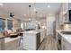 Spacious kitchen island offers seating and ample counter space, great for entertaining at 431 Courtfield Way, Castle Pines, CO 80108