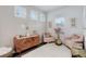 Cozy sitting room with plush armchairs, soft lighting, and stylish decor, creating a relaxing retreat at 431 Courtfield Way, Castle Pines, CO 80108