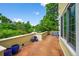 Relaxing outdoor balcony offers a tranquil escape with beautiful views of the surrounding greenery and colorful potted plants at 1564 S Uinta Way, Denver, CO 80231