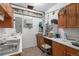 Unfinished basement space with cabinets, sink, work space, and exposed ceiling at 1564 S Uinta Way, Denver, CO 80231