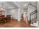 Spacious dining room features an adjacent staircase and hardwood floors, perfect for Gathering gatherings and entertaining guests at 1564 S Uinta Way, Denver, CO 80231