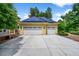 Spacious three-car garage with solar panels, offering ample parking and environmentally friendly energy solutions at 1564 S Uinta Way, Denver, CO 80231