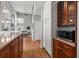 Elegant kitchen with granite counters and a view into a brightly lit living space at 1564 S Uinta Way, Denver, CO 80231